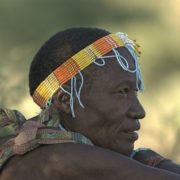 elderly man with beaded headband