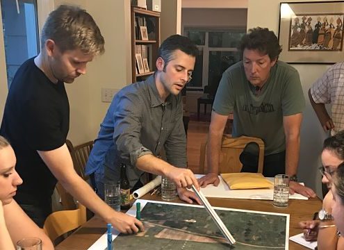 team members studying site map