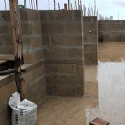 cement block walls seven rows tall with window and doorway openings