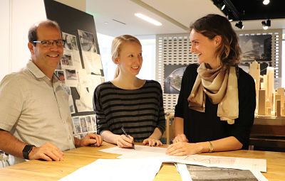 three architects at planning desk