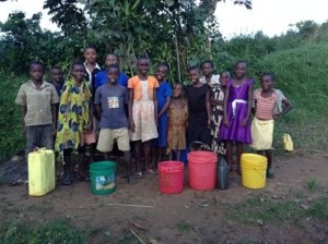 kids with colorful plastic buckets and containers